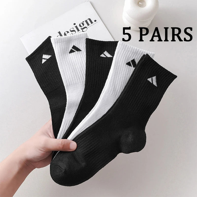 5 pairs of black and white patterned mid length socks